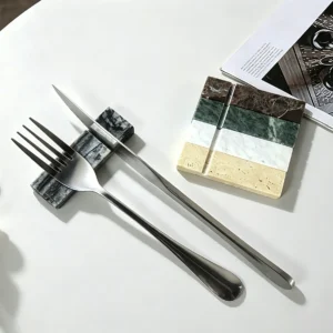 Multi-color natural marble knife fork rest collection dining table styling, black grey marble utensil holder with metal cutlery, luxury stone table decor for restaurants